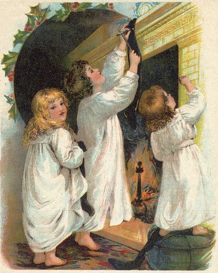 Children Hanging Christmas Stockings
